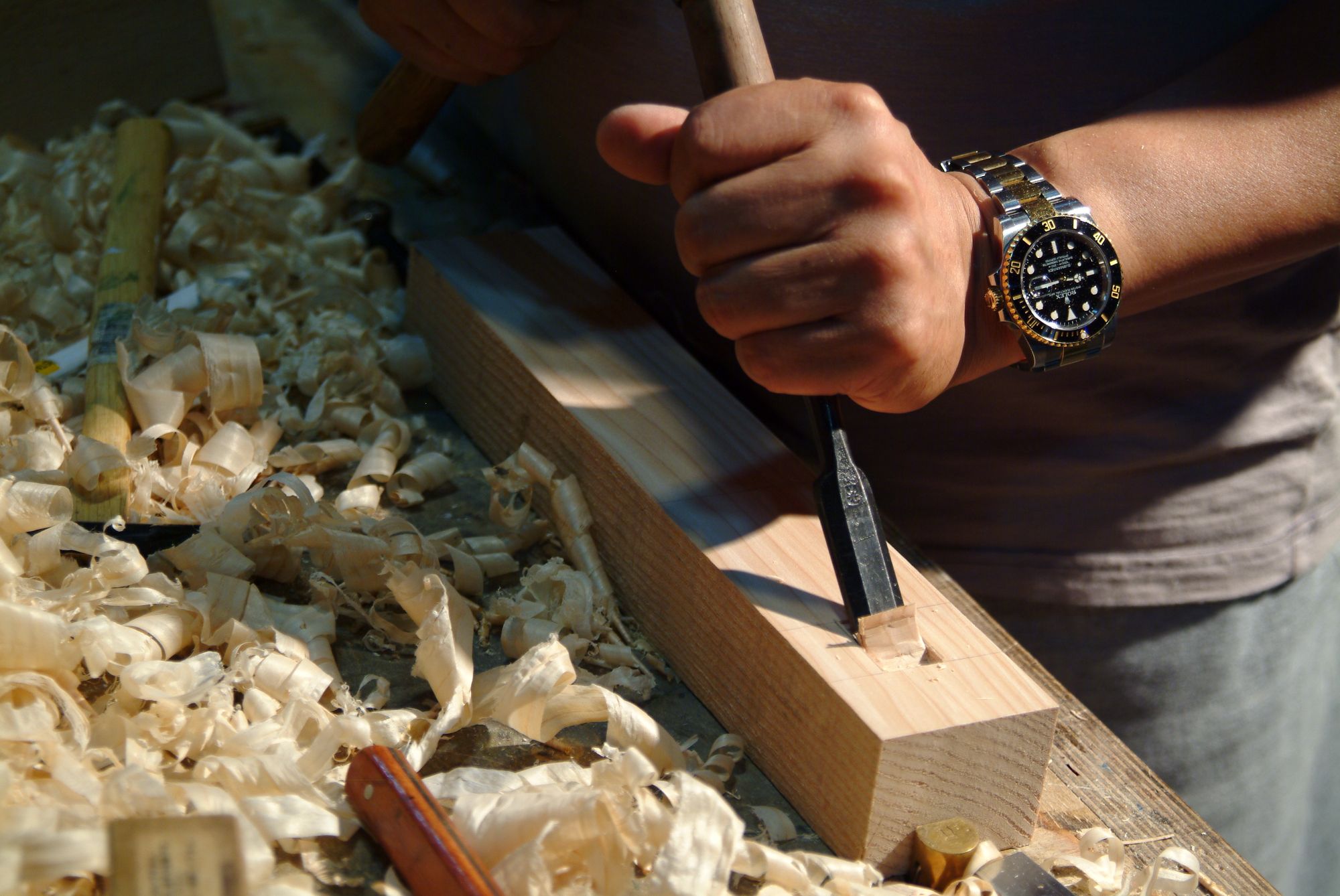 Close-up of a chisel cutting a fine dovetail joint
